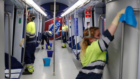 Workers cleaning the Madrid metro on March 16, 2020 